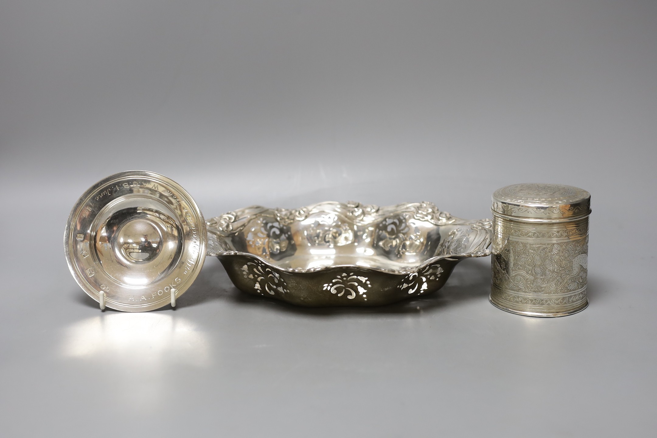 An American pierced sterling bowl, by Caldwell & Co, 28.5cm, a 1960's small silver armada dish and an Egyptian white metal canister and cover